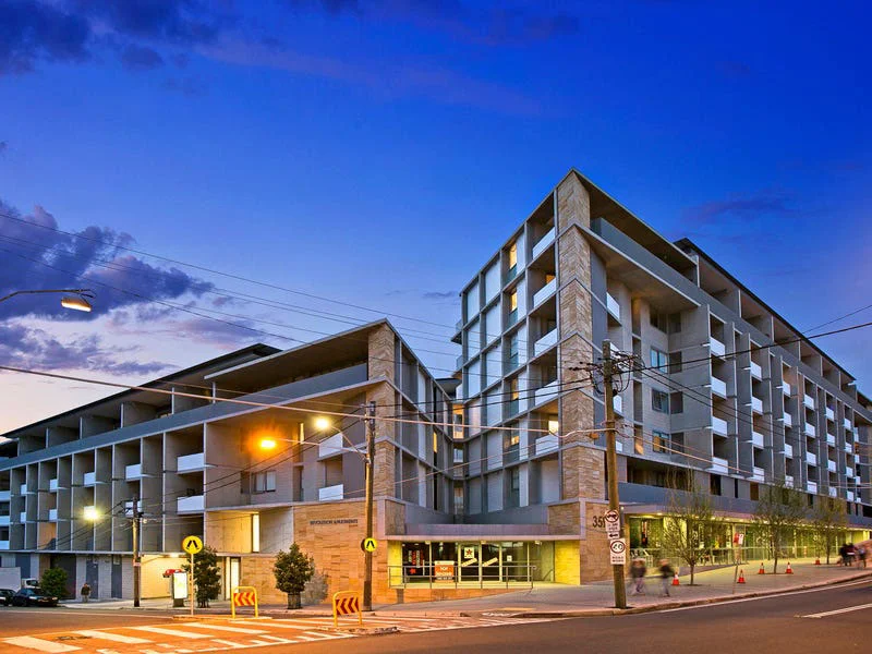 Exterior view of modern residential building at 178-180 Livingstone Road NSW during dusk, multi-storey apartments